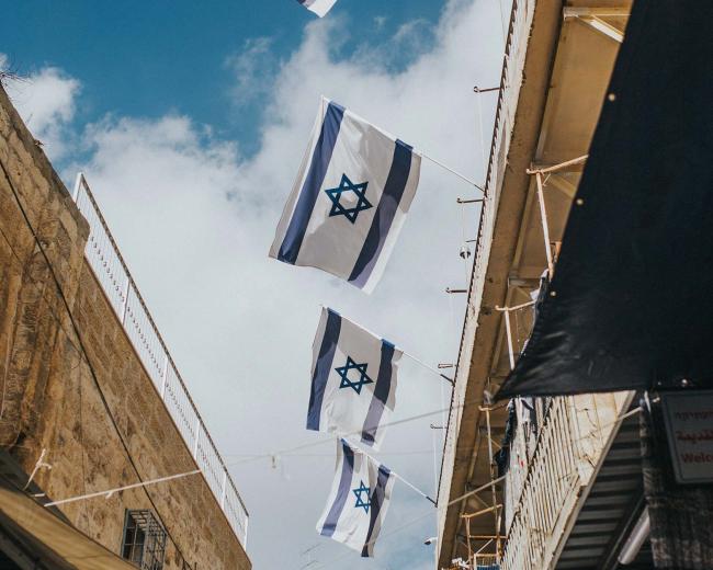 Photo of Israeli flags. Would you like to do a gap year in Israel?